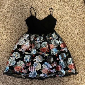 Homecoming dress. It’s a black Teeze Me dress with flowers. Size 3-4